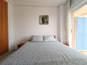 Ένα ή περισσότερα κρεβάτια σε δωμάτιο στο Ayf despertares frente al mar +41 φωτογραφίες
