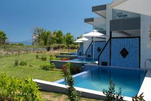 Bazén v ubytování ELYSIUM VILLAS Quartet nebo v jeho okolí