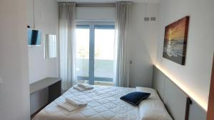 Postel nebo postele na pokoji v ubytování Hotel Capri + 37 fotografií