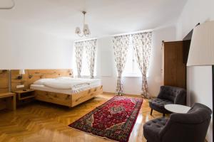 Postel nebo postele na pokoji v ubytování KIRCHENWIRT an der Weinstrasse - Boutique Hotel