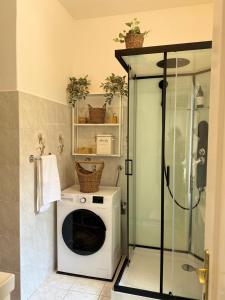 a washer and dryer in a bathroom with a shower at BRAND NEW City Center Apartment Nostalgija in Split +25 photos
