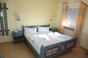 Postel nebo postele na pokoji v ubytování Berggasthof Hotel Igelwirt