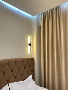 Ένα ή περισσότερα κρεβάτια σε δωμάτιο στο Hotel
