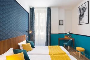 En eller flere senger på et rom på Hotel Nap By HappyCulture