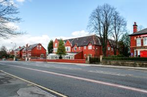 an empty street with houses in the background at Trivelles Mayfair,stockport in Manchester +22 photos