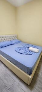 a bed in a room with a mattressvisor at Summer Apartments in Shengjin in Shëngjin