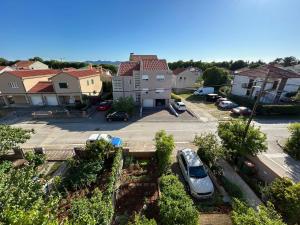 an aerial view of a parking lot in a residential neighborhood at Apartmani Lucija in Zadar