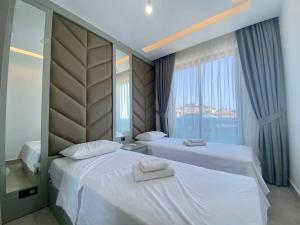 a hotel room with two beds and a window at Boutique 16 - Alanya Experience in Alanya +146 photos