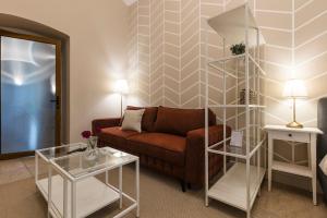 a living room with a couch and a table at #Comfy Apartment in Old Town in Timişoara