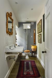 a bathroom with a sink and a toilet at Luxury 5-Bed Country Retreat in the Angus Glens in Glenogil +54 photos