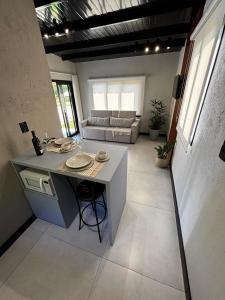 a kitchen and living room with a table and a couch at Casa do Bem Estar Picada Café in Picada Cafe +32 photos