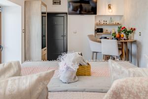 a living room with a table with a basket at Seafront Apartment Balcony Panoramic View in Kaštela +18 photos