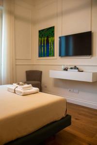 TV a/nebo společenská místnost v ubytování MARI Luxury Rooms and Suites