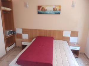 En eller flere senge i et værelse på Fiori Di Roma Roberto Imoveis + 12 billeder