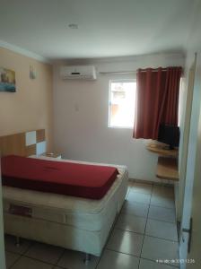 En eller flere senge i et værelse på Fiori Di Roma Roberto Imoveis