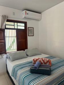 Postel nebo postele na pokoji v ubytování Casa Mangue