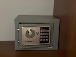 a brown and gray microwave sitting on a table at The Sunny Spot in Sunny Beach