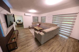 a living room with a couch and a table at Holiday Residence Šehić in Visoko