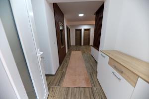 an empty hallway with a hallway leading into a room at Holiday Residence Šehić in Visoko