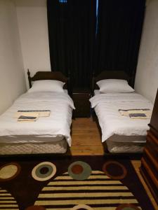 Ein Bett oder Betten in einem Zimmer der Unterkunft Sobe Sarajevo