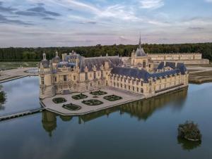 an aerial view of a castle in the water at Ancienne maison de famille in Roberval