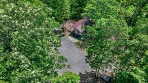 an overhead view of a house in the middle of trees at Happy Glamper RV at Haven of Hope near Little River Canyon National Preserve in Fort Payne