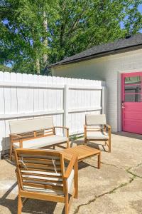 two benches and a table and a pink door at Pink Nashville Cottage - Girls' Trip, 12 Min to Broadway in Nashville +10 photos