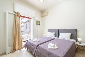 Katil atau katil-katil dalam bilik di Aloe Apartments Sitia