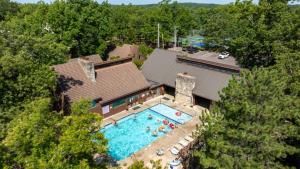 an overhead view of a swimming pool in front of a house at Knolls Worries-Condo/2BD/2BA/Pool/Deck/Dock/Grill/BoatSlip/Tennis-8PP in Osage Beach