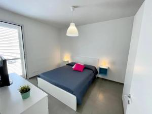 En eller flere senge i et værelse på Villa Ippocampo