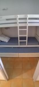 a room with a bunk bed with a white shelf at Maryse in Moliets-et-Maa +16 photos