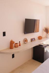 TV a/nebo společenská místnost v ubytování Vila Jangada Xandó Caraíva