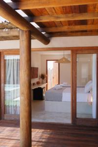 Postel nebo postele na pokoji v ubytování Vila Jangada Xandó Caraíva + 9 fotografií