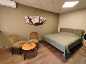 Postel nebo postele na pokoji v ubytování Green Orchid appartment