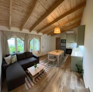 a living room with a couch and a table at Garden House Flogita in Flogita