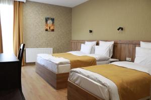 Postelja oz. postelje v sobi nastanitve Hotel 717 Kazbegi