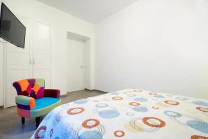 A bed or beds in a room at Talia Ortigia Apartment