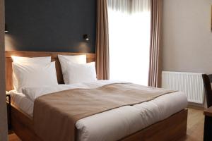 Postelja oz. postelje v sobi nastanitve Hotel 717 Kazbegi