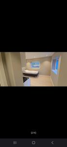 a view of a kitchen with a stove and windows at Cozy studio apartement in Bergen