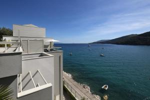 a view of a body of water from a building at Boutique Hotel Adoral in Rabac
