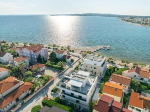 an aerial view of a city and the water at Villa PUNTA DURA in Vir