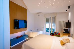 a bedroom with a bed and a tub in it at Incanto in Cosenza