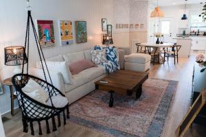a living room with a couch and a table at Kim's Place on Cigar Hill - 41 W High St in Clarksville