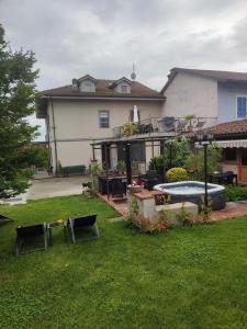 a house with a yard with a swimming pool at Casa Lilly in San Paolo Solbrito