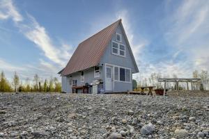 a house sitting on top of a pile of rocks at Lake View LOFT Cabin off grid Solar in Wasilla +33 photos
