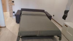 a pair of beds in a room with at Maggioli3 in Alessandria