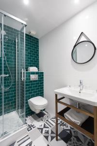 a bathroom with a toilet and a sink and a shower at Hotel Nap By HappyCulture in Nice