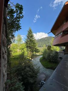 a view of a river from a balcony of a house at Ermi Apartment Temù in Temù