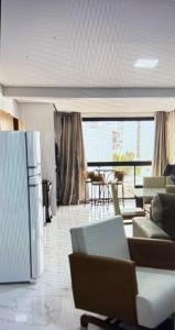 a living room with couches and chairs and a table at Apto a 100 metros das piscinas Balneário Piratuba in Água Doce +27 photos