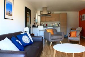 a living room with a couch and a table at Spacious Central Family Apartment in London